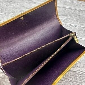 AUTHENTIC Louis Vuitton Epi Porte Tresor International wallet. Tassel yellow.